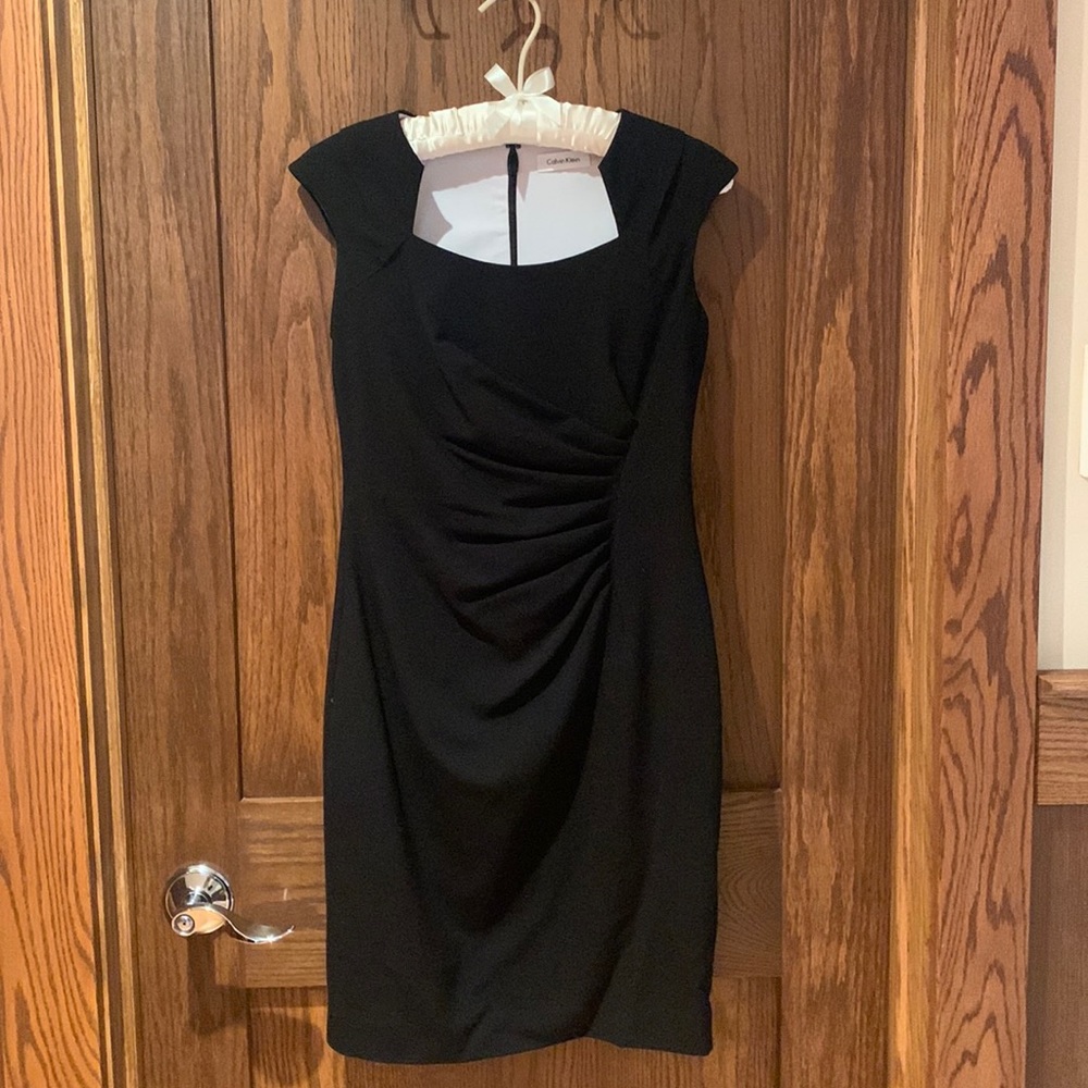 Size 4, Calvin Klein. Black, knee-length, classic dress. Worn once.
